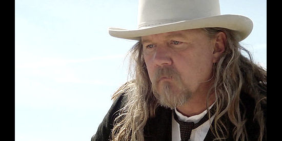 Trace Adkins as Miflin Kenedy, the influential father of Spike and Sam in Wyatt Earp's Revenge (2012)