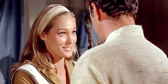 Ursula Andress as Maxine Richter, promising Joe Jarrett (Dean Martin) she'll stop playing 'come along' with Zack Thomas in Four for Texas (1963)