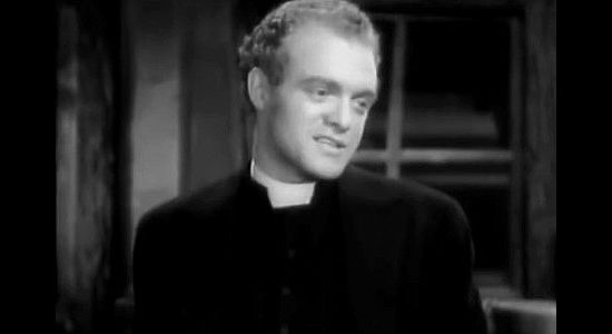 Van Heflin as The Rev. Sam Woods, holding his first service in Oakhurst's gambling hall in The Outcasts of Poker Flat (1937)