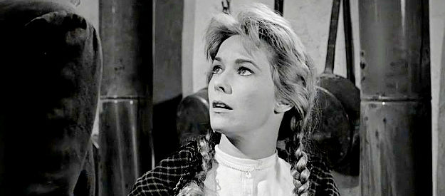 Vera Miles as Hallie Stoddard, concerned about the wounded man Tom Doniphon delivers to her home in The Man Who Shot Liberty Valance (1962)