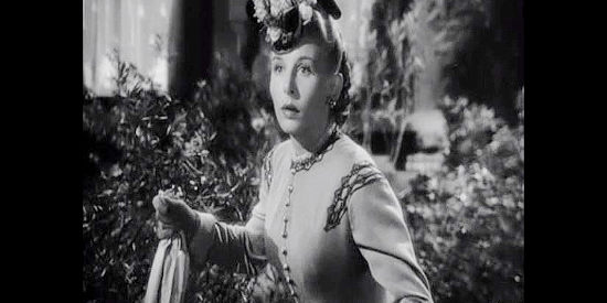 Vera Ralston as Sandy, alarmed when she realizes her father is trying to harm the man she just married in Dakota (1945)