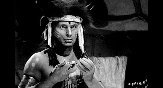 Victor Varconi as Painted Horse, noticing the picture of Calamity Jane in Wild Bill's watch in The Plainsman (1936)