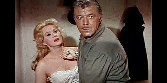 Virginia Mayo as Linda Lee, locked in a struggle with Bo Greer (James Craig) in Fort Utah (1967)