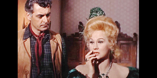 Virginia Mayo as Sara McCoy, fretting over her son's future with Clint McCoy (Rory Calhoun) in Young Fury (1965)