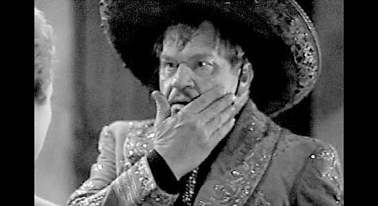 Wallace Beery as Pancho Lopez, reacting to a slap in the face from Lucia Pell in The Bad Man (1941)