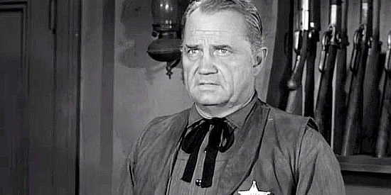 Walter Sande as Marshal Tom Evans, getting unwelcome news about an outlaw gang headed toward town in Noose for a Gunman (1960)