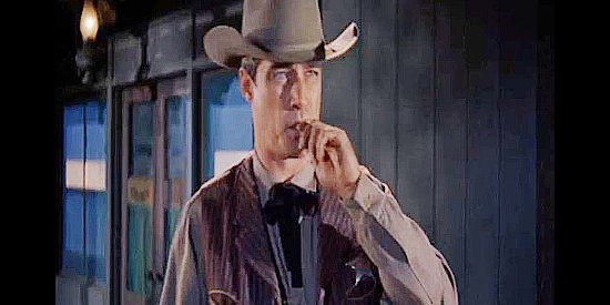 Ward Ramsey as Marshal Webb, making the late-night rounds in Paradise in Posse from Hell (1961)