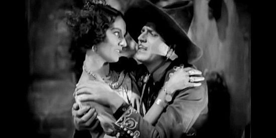 Warner Baxter as The Cisco Kid, planning to flee to Portugal with Tonia Maria (Dorothy Burgess) until he discovers the truth In Old Arizona (1928)