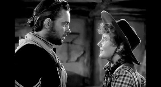 William Holden as Peter Muncie and Jean Arthur as Phoebe Titus, together again after the war breaks out in Arizona (1940)