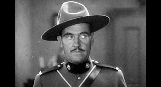 Wlater McGrail as Sgt. Martin, hoping his sleuthing will give him a new opportunity iwth Miriam McDowell in River's End (1930)
