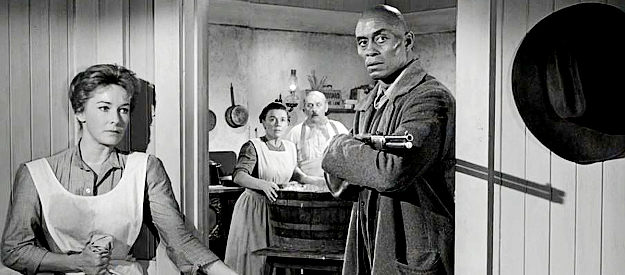 Woody Strode as Pompey, backing up Tom Doniphon as Hallie (Vera Miles) looks on in The Man Who Shot Liberty Valance (1962)