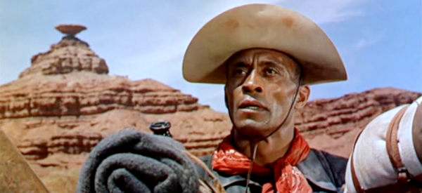 Woody Strode as Sgt. Rutledge, watching Indian attack a settler's ranch in Sergeant Rutledge (1960)