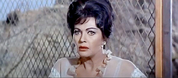 Yvonne De Carlo as Laura Mannon, a former acquaintance of McCool's, now traveling in his prison wagon in Hostile Guns (1967)