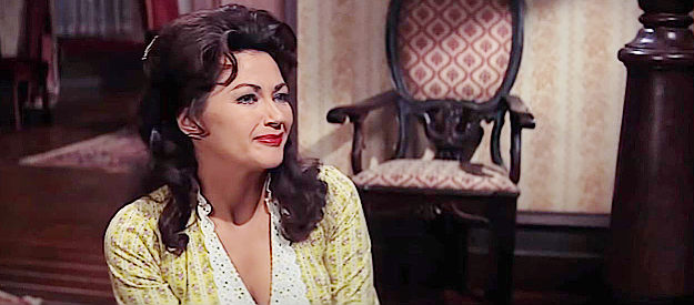 Yvonne DeCarlo as Louise Warren, the house keeper who arouses Katherine McLintock's jealousy in McLintock! (1963)