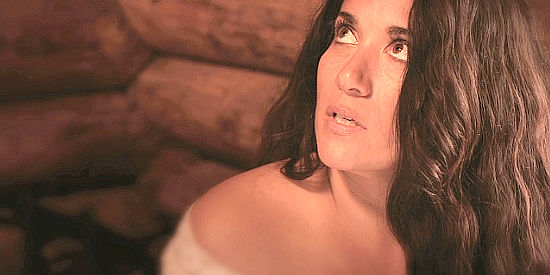 Yvonne Delarosa as Maria Hazard, shocked by her son's gift in a flashback scene in A Sierra Nevada Gunfight (2012)
