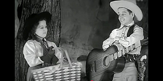 Yvonne Moray as Nancy Preston and Billy Curtis as Buck Lawson, meeting for a clandestine picnic in The Terror of Tiny Town (1938)