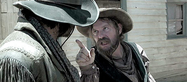 Beau Smith as Clay, making a point prior to a bank robbery in The Redemption of Henry Myers (2014)