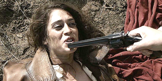 Lizzy Caplan as Juliette Flowers, under the gun of the Rev. Early Pride in The Last Rites of Ransom Pride (2010)