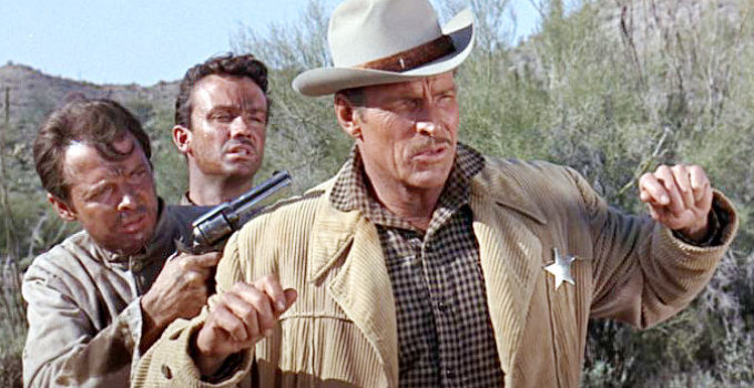 Audie Murphy as Clint and Ben Cooper as Willie Martin, staging an escape from Capt. Andrews (Buster Crabbe) in Arizona Raiders (1965)