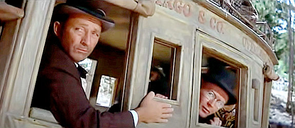 Bing Crosby as Doc Josiah Boone and Red Buttons as whiskey salesman Peabody during an unexpected stop in Stagecoach (1966)