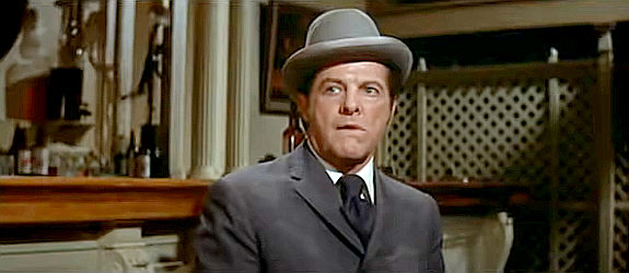 Robert Cummings as Henry Gatewood, a traveler with a secret in Stagecoach (1966)