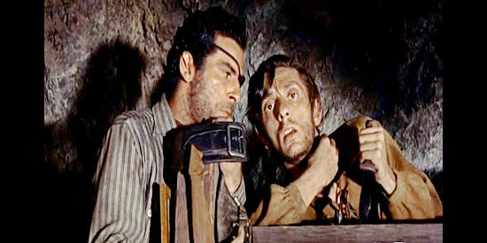 Aaron Spelling (right) as Petie Carver, trying to remember where he stashed his gold while fellow gang member George Curry (George Keymas) listens in Wyoming Renegades (1955)