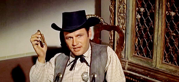 Adam WIlliams as Leslie, the hot-shot young deputy doing Lounsberry's bidding in The Badlanders (1958)