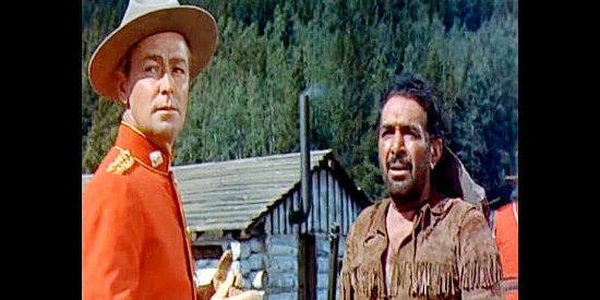 Alan Ladd as Thomas O'Rourke and J. Carroll Naish as Batouche, discouraging a commander's misguided Indian policy in Saskatchewan (1954)