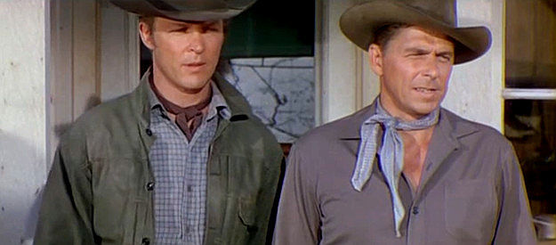 Alex Nicol as Lute Johnson and Ronald Reagan as Frame Johnson, holding off a lynch mob in Law and Order (1953)