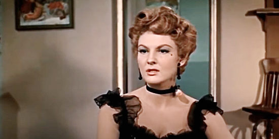 Allison Hayes as Erica Page, the saloon owner gambling on the railroad coming to town in Gunslinger (1956)