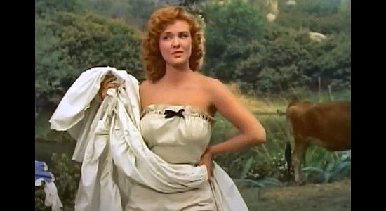 Allison Hayes as Greta Jones, posting for one of Jonathan Adams' landscapes in Mohawk (1956)