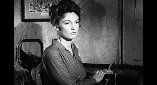 Allison Hayes as Sherry, preparing to run off with Cheney in spite of his many misdeeds in A Lust to Kill (1958)