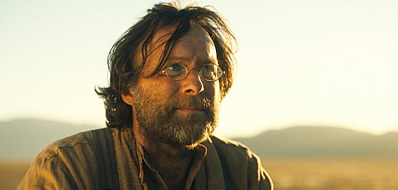 Andrew Robertt as Werner, the writer who cheats Jay out of everything he owns in Slow West (2015)