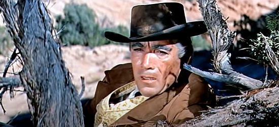 Anthony Quinn as Tom Morgan, engaged in some thievery on the side in Warlock (1959)