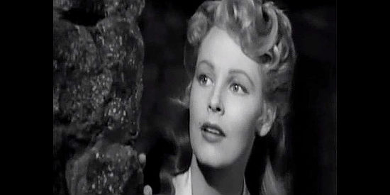 Arlene Dahl as Ann Duverall, watching the cavalry patrol return in Ambush (1950)
