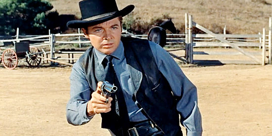 Audie Murphy as Joe Gant, a notorious gunman who always gets his prey to put up a fight in No Name on the Bullet (1959)