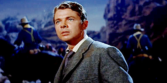 Audie Murphy as John P. Club, reacting to the sudden arrival of armed soldiers at San Carlos in Walk the Proud Land (1956)