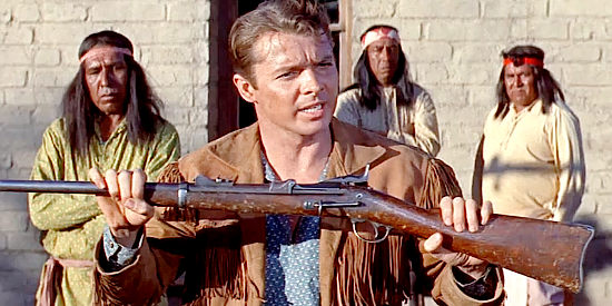 Audie Murphy as John P. Clum, returning weapons to the Apache for hunting only in Walk the Proud Land (1956)