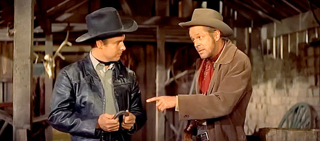 Audie Murphy as The Utica Kid,' getting on the nerves of gang leader Whitey Harbin (Dan Duryea) yet again in Night Passage (1957)