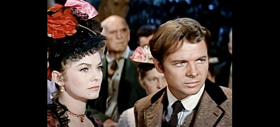 Audie Murphy as Yancey Hawks, defending the honor of Marcy Howard (Joanne Dru) in The Wild and the Innocent (1959)