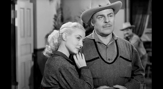 Audrey Totter as Kate Quantrill with Brian Donlevy as Charles Quantrill, doing her best to make an old lover jealous in The Woman They Almost Lynched (1953)