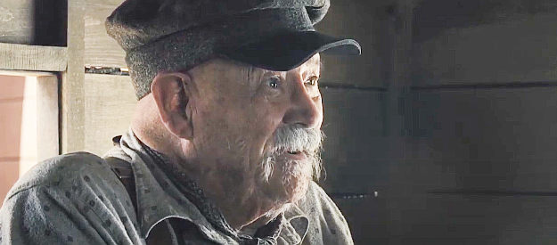 Barry Corbin as Buster Shaver, the blacksmith who prepares a wagon for Mary Bee's journey in The Homesman (2014)