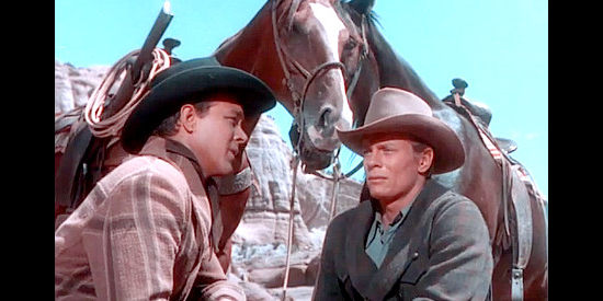 Ben Johnson as Ben Shelby and Peter Graves as Ned Tallon, on the run from Dave Parker and his men in Fort Defiance (1951)