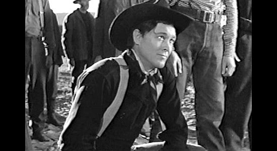 Ben Johnson as Travis Blue, the wagon guide who only shoots at snakes in Wagon Master (1950)