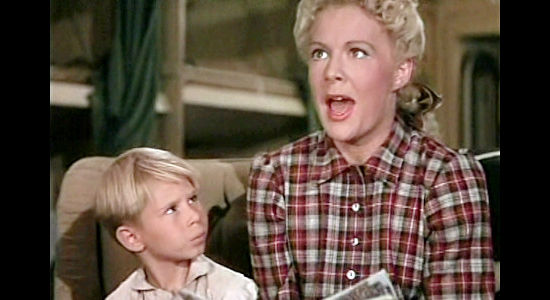 Betty Hutton as Annie Oakley, giving reading lessons to Little Jake (Brad Morrow) in Annie Get Your Gun (1950)