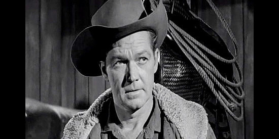 Bill William as Sheriff Pete Colton, warning gunman Bart Jones to leave town in The Storm Rider (1957)