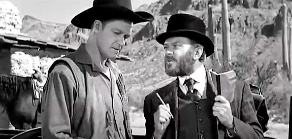 Bill Williams as Bill Gentry, investigating Alvarado's death with the help of Doc Mott (William 'Bill' Phillips) in The Broken Star (1956)