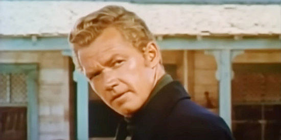 Bill Williams as George Newcomb, taking an interest in Rose as soon as he sees her in Rose of Cimarron (1952)