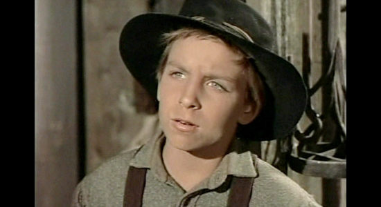 Billy Chapin as Jody Burrows, the young boy who quickly becomes attached to the stranger who arrives at his father's stage station in Tension at Table Rock (1956)