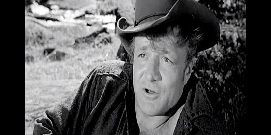 Brian Keith as Clett, a gun-runner making his play for Celia Gray in Fort Dobbs (1958)